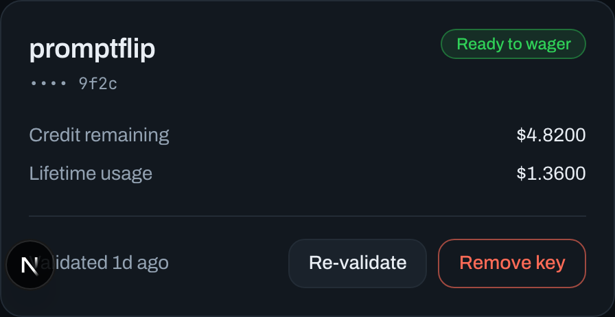 PromptFlip's saved key card, showing a Ready to wager badge, the key's last four characters, its remaining limit and lifetime usage, and Re-validate and Remove key buttons.